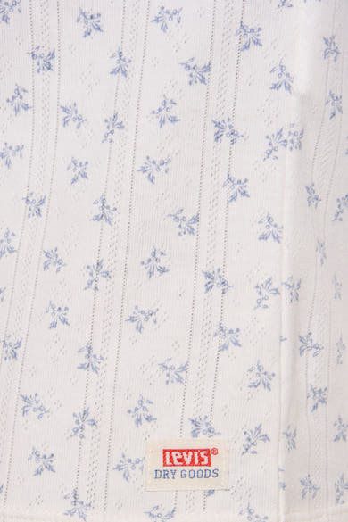 T-shirt blanc à fleurs de Levi's, à rayures verticales perforées et étiquette de marque.