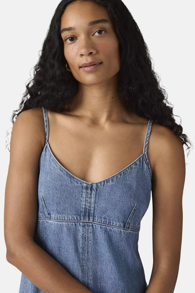 Denim robe in medium blue wash by Levi's, featuring spaghetti straps and a V-neckline, shown in front view on model.