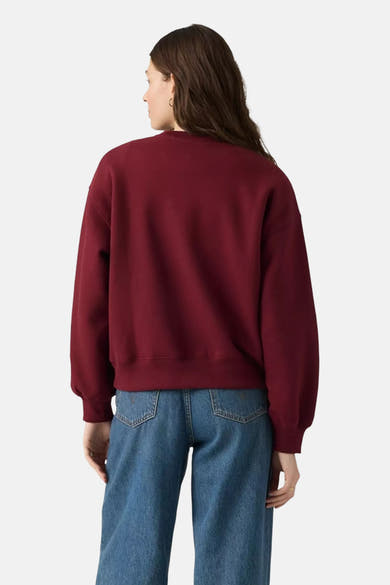 Bordeaux crewneck sweatshirt back view, soft cotton blend, relaxed fit, paired with blue jeans