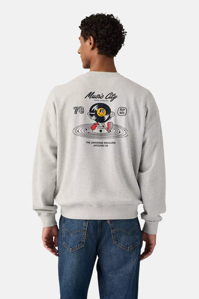 Grey crewneck sweatshirt with graphic print featuring Music City vinyl character, back view on model wearing blue jeans