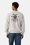 Grey crewneck sweatshirt with graphic print featuring Music City vinyl character, back view on model wearing blue jeans