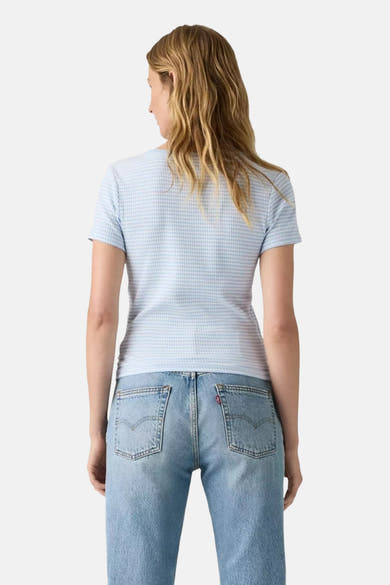 Blue short-sleeve t-shirt with fine white check pattern, back view, worn with light wash jeans