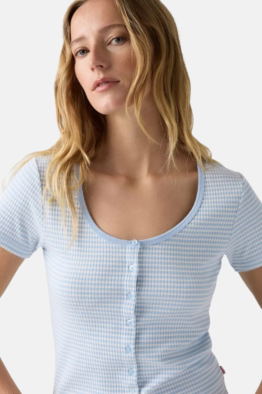 Blue short-sleeve gingham t-shirt with front buttons and ribbed trim, worn by model in cropped lifestyle view