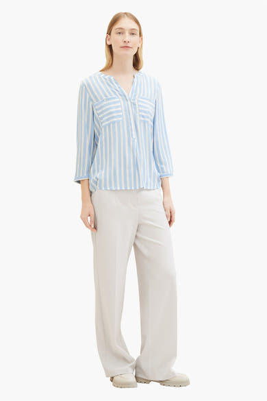 Blouse bleue rayée à manches longues de Tom Tailor avec poches plaquées et coupe décontractée.
