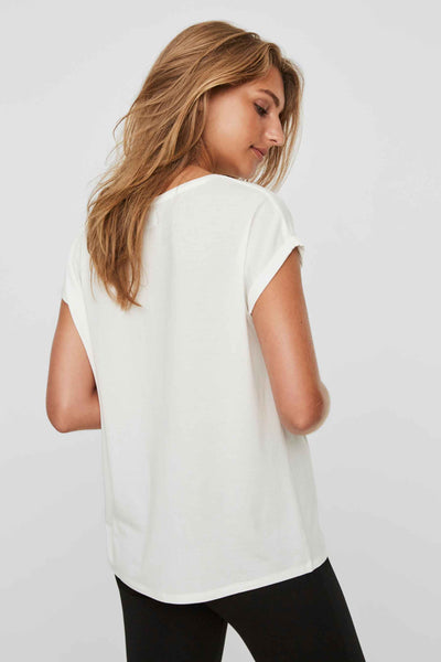 White short-sleeve top with relaxed fit and rounded hem, back view on model wearing black pants