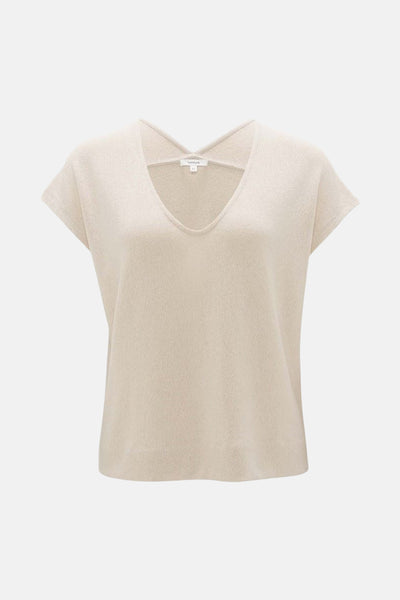 Blouse à manches courtes écru de OPUS, avec une encolure en V, en texture tricotée.
