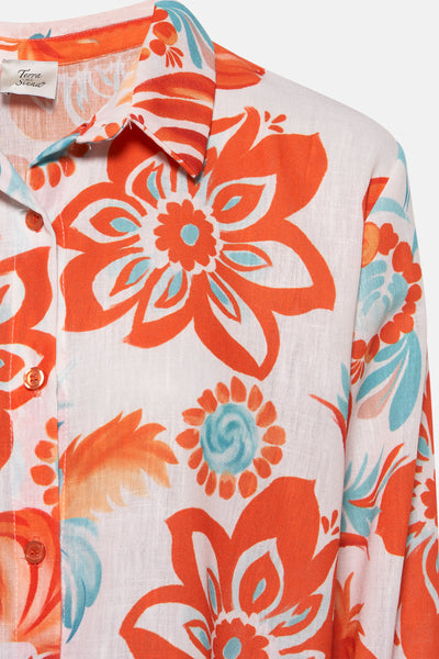 Chemisier à manches longues multicolore de Terra di Siena, avec motif floral orange et bleu, vue rapprochée.
