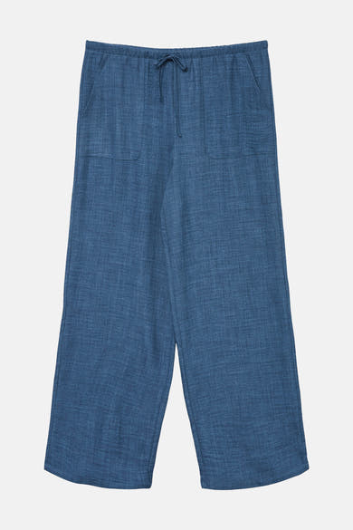 Pantalon coloré bleu de VERO MODA, à poches et cordon de serrage, sur fond uni.