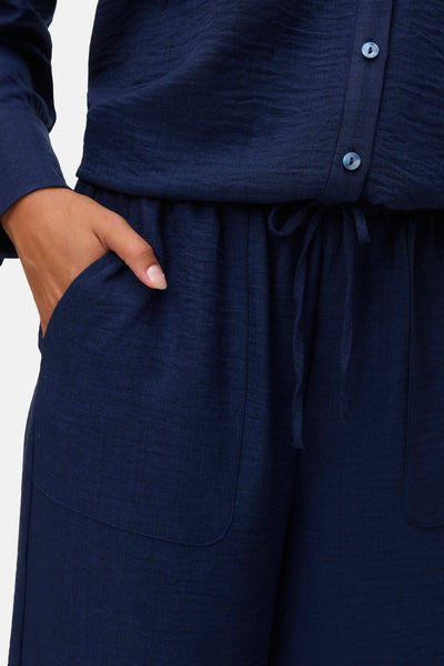 Pantalon bleu de VERO MODA, avec poches et cordon de serrage à la taille.
