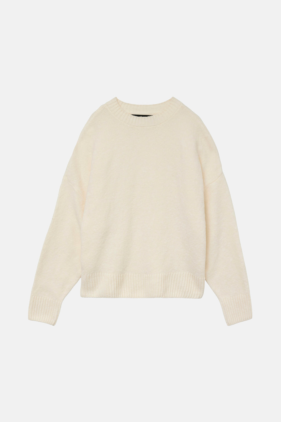 Pull écru à col rond de Vero Moda, en tricot doux avec des bords côtelés.

