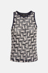 Blouse bleue sans manches de Vero Moda, motif géométrique ajouré.
