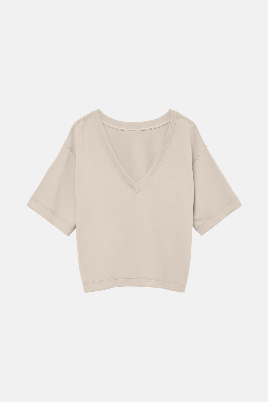 T-shirt écru à manches courtes de VERO MODA, coupe ample et décolleté en V.