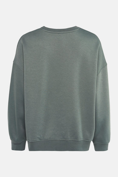 Groene trui van VERO MODA, losse pasvorm en lange mouwen, van achteren gezien.
