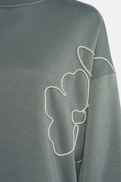 Sweat-shirt vert, à col rond par VERO MODA®, avec motif floral en relief sur le devant.
