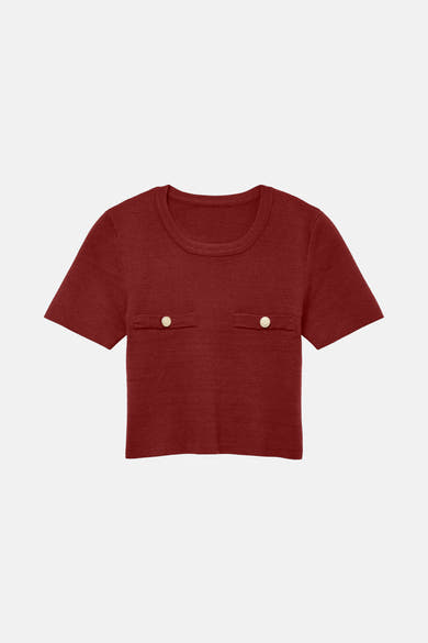 Bordeaux trui van VERO MODA met twee zakken en gouden knopen.