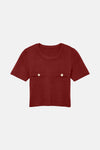 Bordeaux trui van VERO MODA met twee zakken en gouden knopen.