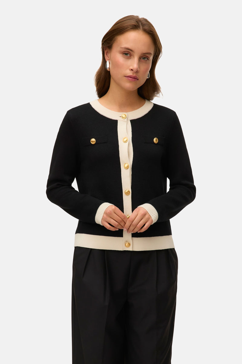 Zwart gilet van VERO MODA, met gouden knopen en contrasterende crèmekleurige details.