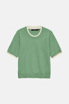 Pull à col rond vert de VERO MODA, avec col et manches courtes contrastantes couleur crème.

