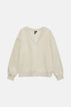 Sweat beige de Vero Moda, avec des détails perlés aux épaules.
