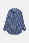 Blouse à manches longues bleue rayée de Vero Moda, coupe ample avec boutons apparents.