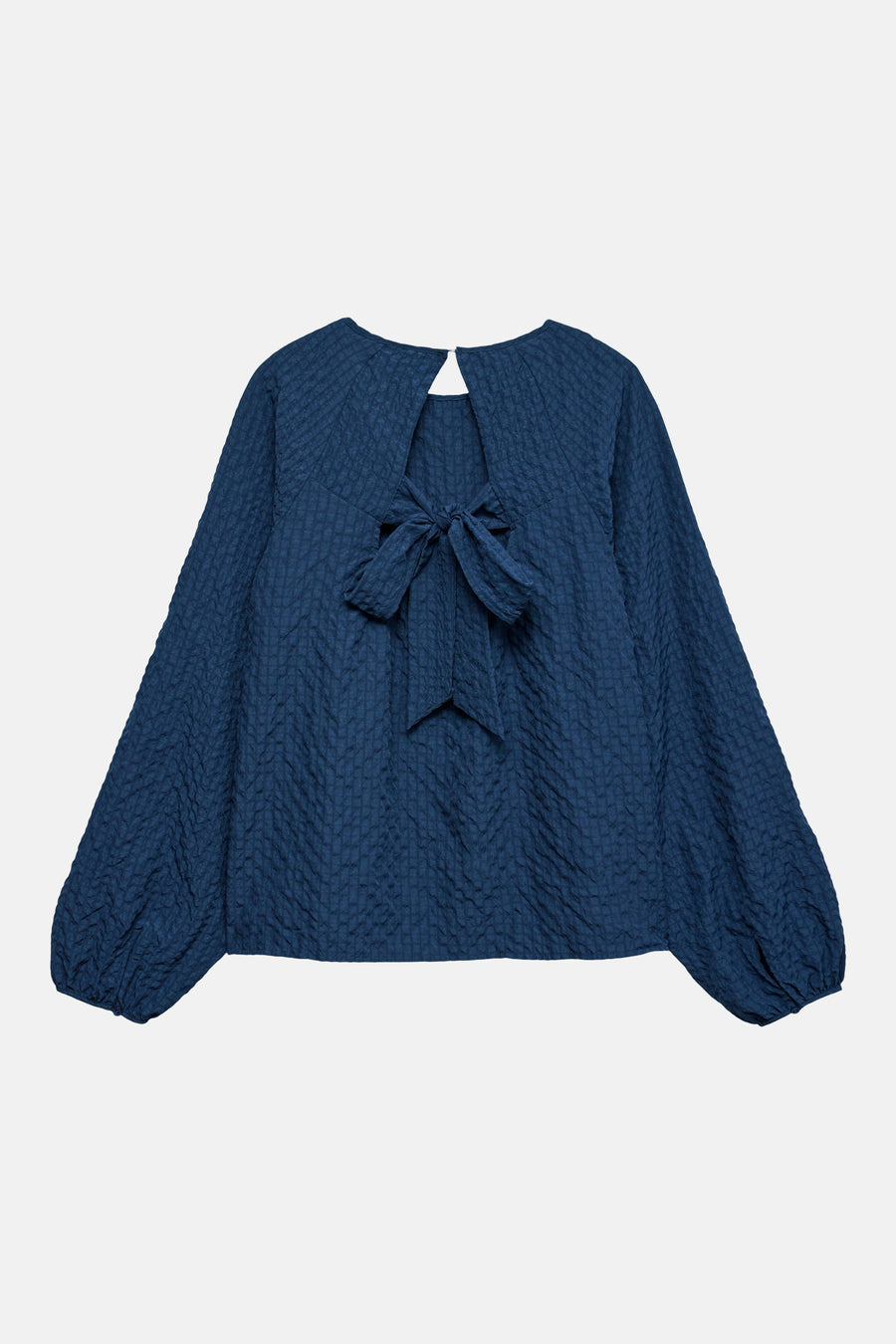 Blouse à manches longues bleue de VERO MODA®, dos ouvert avec un nœud décoratif.