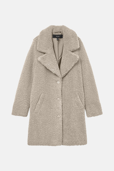 Veste longue beige en fausse fourrure de Vero Moda, avec col à revers et coupe droite.
