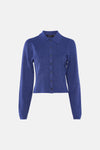 Cardigan bleu en maille côtelée de VERO MODA, avec un col chemise et une fermeture boutonnée.