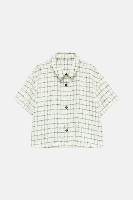 Ecru blouse met korte mouwen van VERO MODA, met zwarte ruit en zwarte knopen.