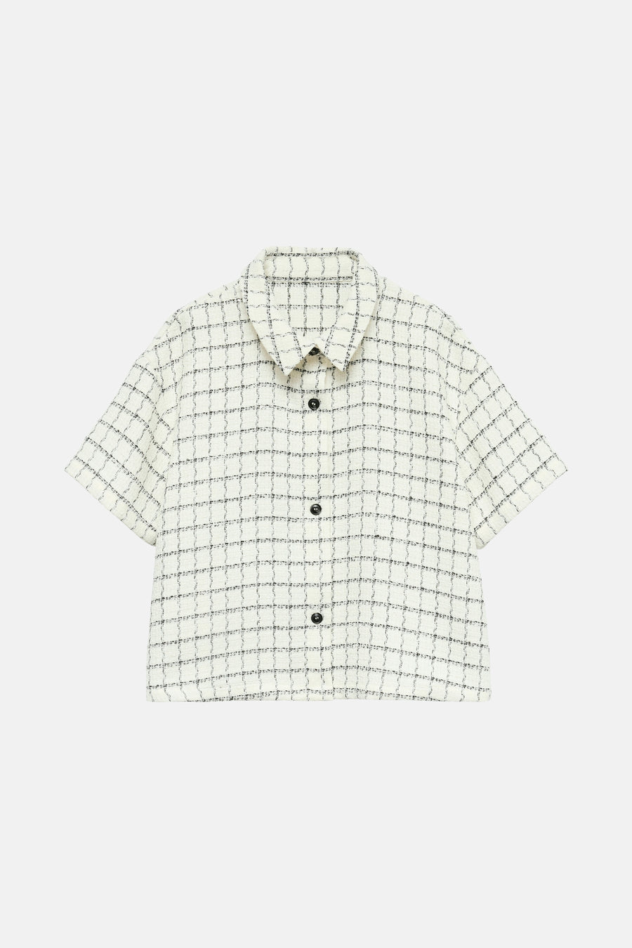 Ecru blouse met korte mouwen van VERO MODA, met zwarte ruit en zwarte knopen.