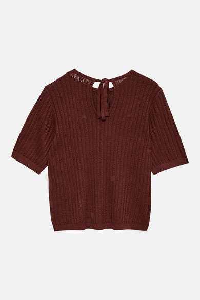 Pull à col rond brun de VERO MODA®, en maille ajourée avec un nœud décoratif à l'encolure dos.