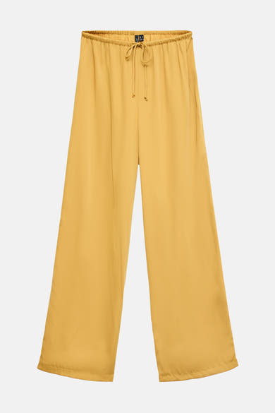 Gouden broek van VERO MODA, met elastische tailleband en gladde textuur.