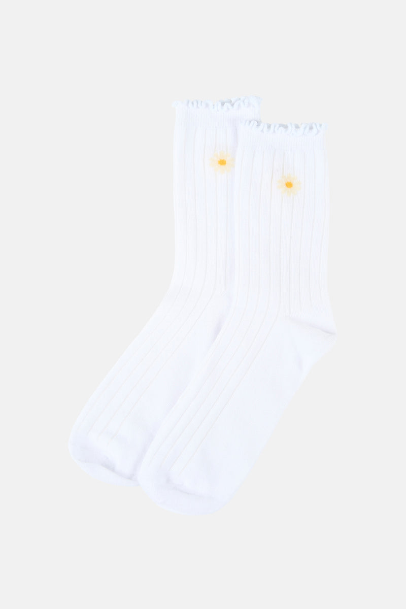 Witte sokken van Vero Moda, met madeliefjespatroon en rucheboord.