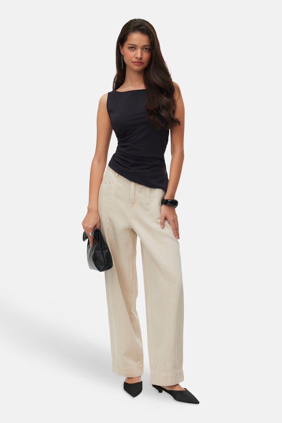Beige wide-leg jeans by VERO MODA, full-length front view, paired with black top and heels, clean studio look