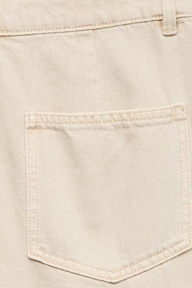 Beige colored jeans by VERO MODA® with visible front pocket, clean stitching, and textured denim fabric in close-up view