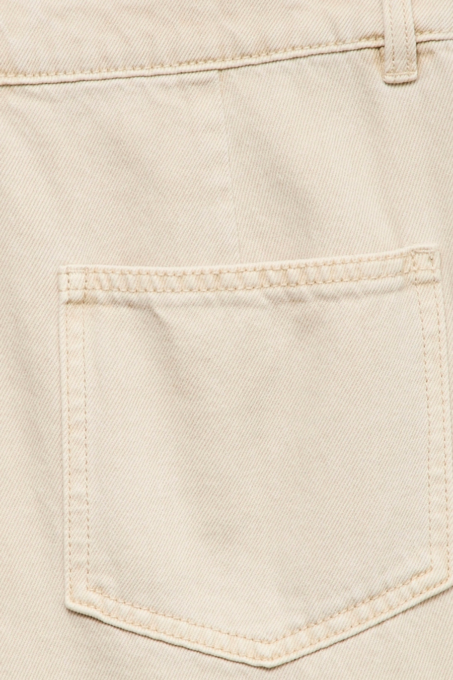 Beige colored jeans by VERO MODA® with visible front pocket, clean stitching, and textured denim fabric in close-up view