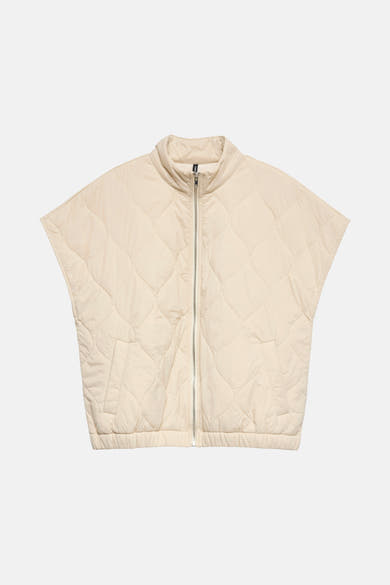 Veste sans manches écru de VERO MODA® à motif matelassé losanges, fermeture éclair centrale argentée.