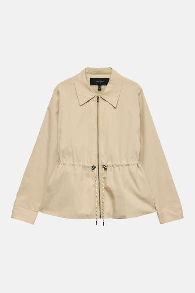 Veste courte beige de Vero Moda avec cordon de serrage à la taille et fermeture éclair.
