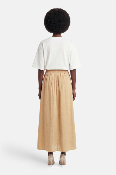 Jupe longue beige de VERO MODA, vue de dos, avec taille élastiquée froncée et texture légère.