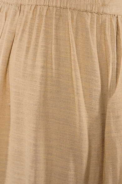 Jupe longue beige de VERO MODA en tissu léger à la texture aérée, avec des plis souples et une taille élastique.