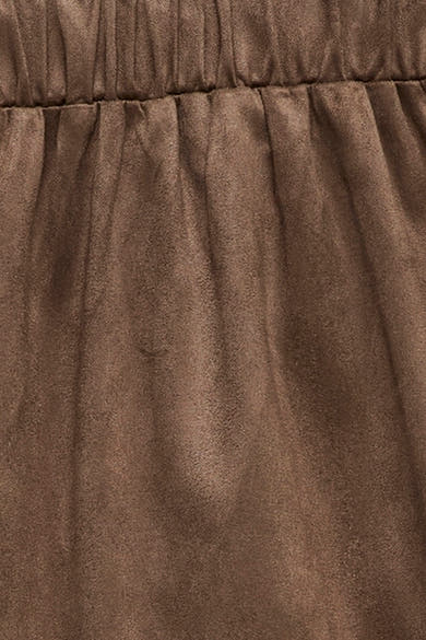 Brown suede-like pants with elastic waistband by Fossil, close-up view showing soft texture and gathered fabric detail