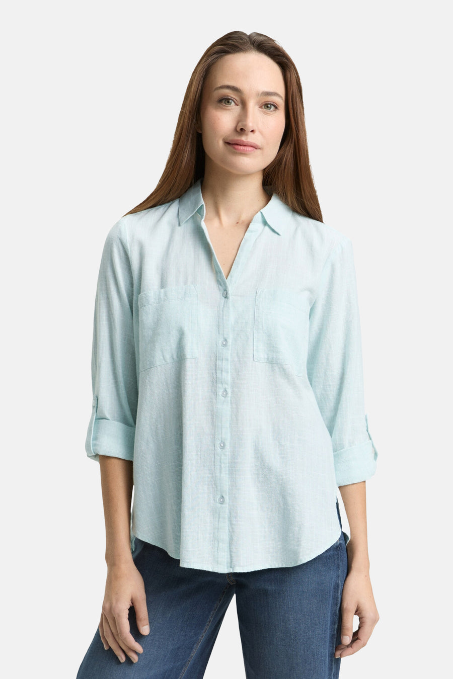 Chemise à manches longues vert clair de Tom Tailor, avec des manches retroussées et des poches à rabat.