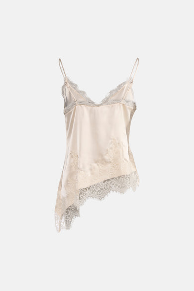Blouse sans manches beige de VERO MODA, ornée de dentelle délicate et d'une coupe asymétrique originale.
