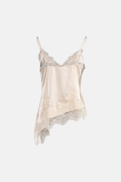 Blouse sans manches beige de VERO MODA, ornée de dentelle délicate et d'une coupe asymétrique originale.

