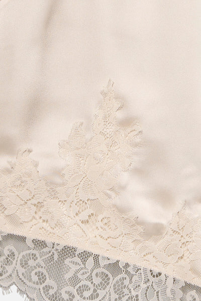 Chemisier beige sans manches de VERO MODA®, orné de dentelle délicate ton sur ton.
