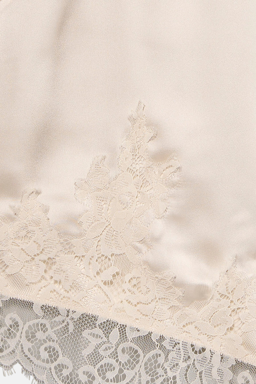 Chemisier beige sans manches de VERO MODA®, orné de dentelle délicate ton sur ton.
