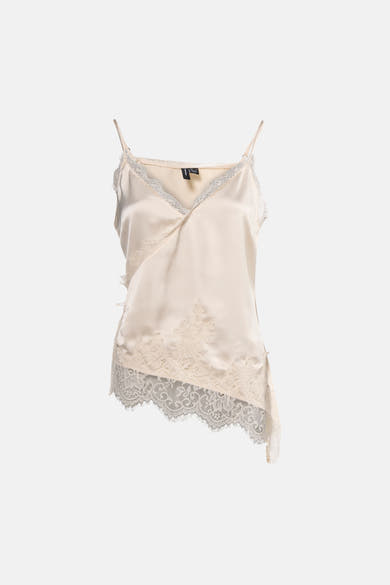 Chemisier sans manches beige de VERO MODA, orné de dentelle délicate et de détails asymétriques.
