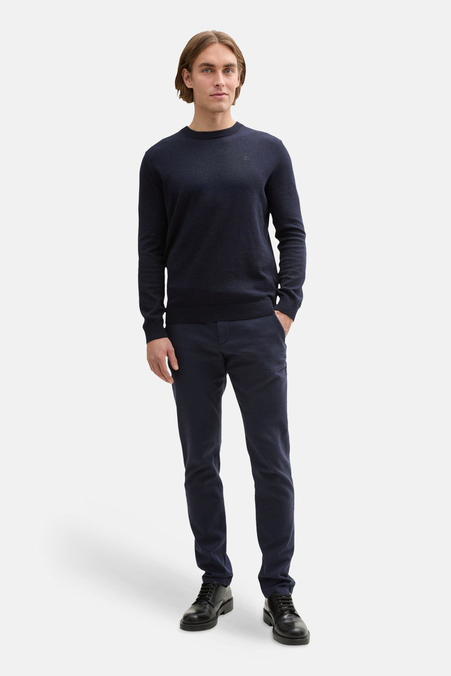 Navy blue chinos by Tom Tailor, slim fit, worn with dark sweater and black shoes, full-length front view