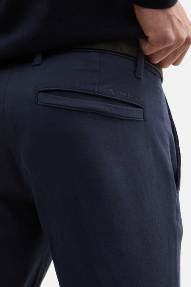Navy blue chinos by Tom Tailor, back view with branded patch on right pocket, smooth cotton blend fabric, slim fit style