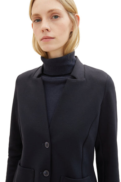 Blauwe blazer van Tom Tailor, met een marineblauwe opstaande kraag en zichtbare ribstructuur.