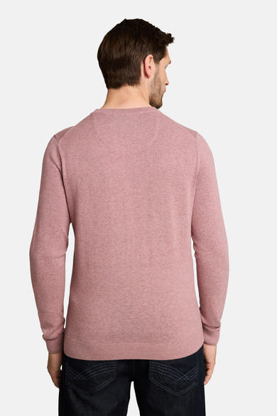 Rose-colored crew neck sweater with ribbed hem and cuffs, back view on model wearing dark jeans